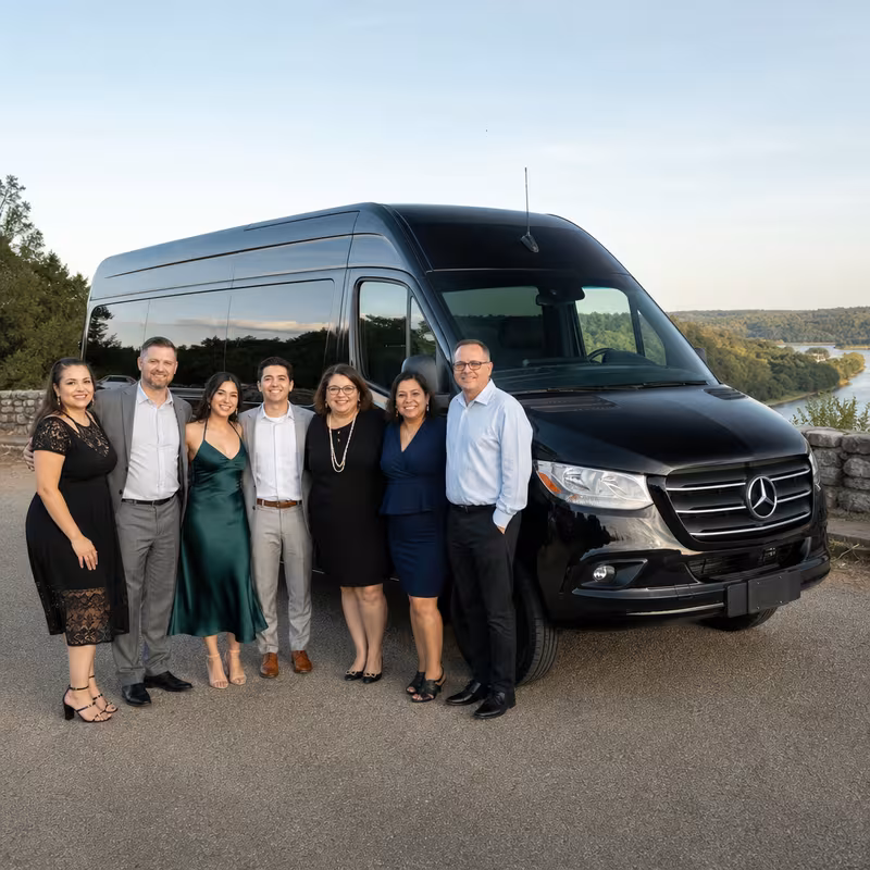 Group beside a Mercedes Sprinter limo from the Omaha fleet