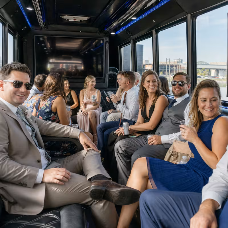 Wedding guests seated inside a Omaha party bus