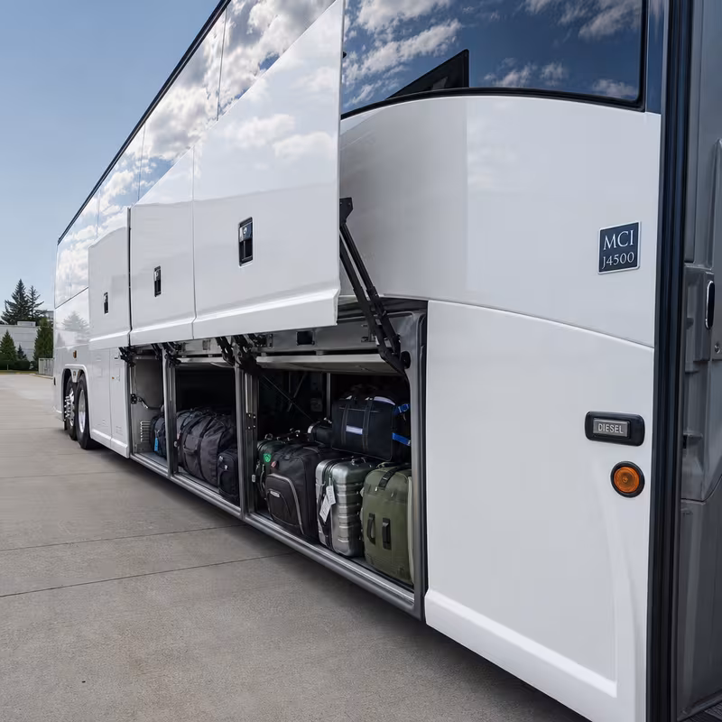 Party bus interior with wraparound leather seating and LED lighting in Omaha