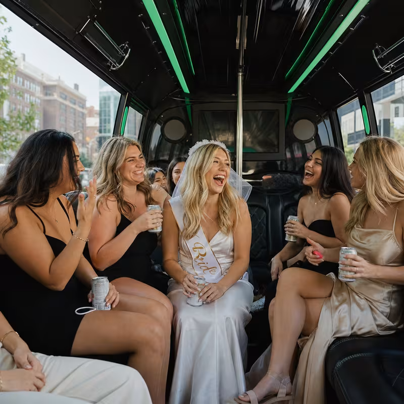 Party bus interior with wraparound leather seating and LED lighting in Omaha