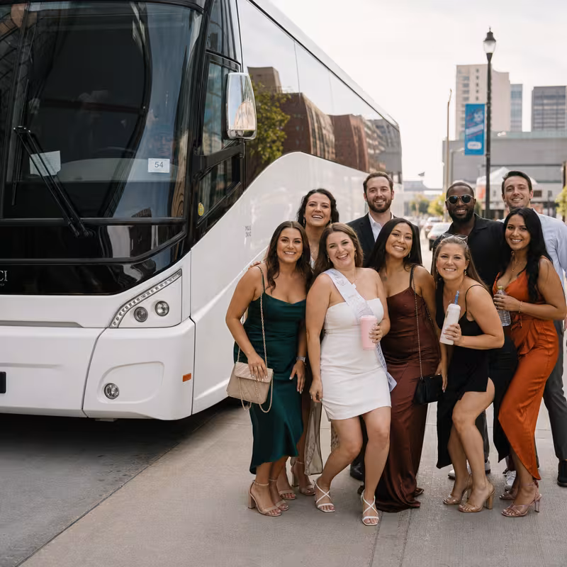 Passengers loading luggage while boarding an Omaha group shuttle