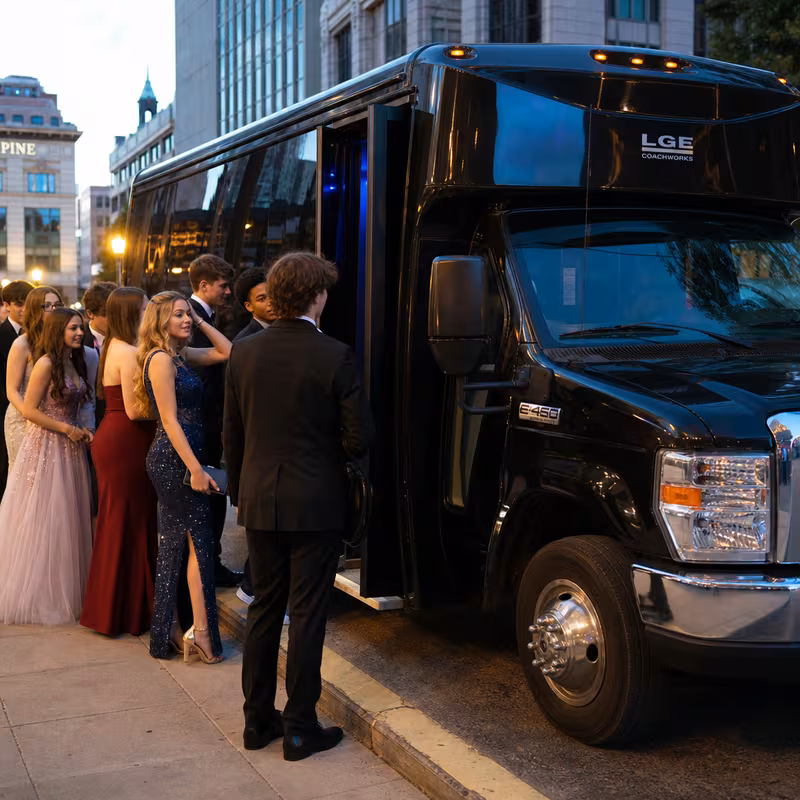 Passengers loading luggage while boarding an Omaha group shuttle