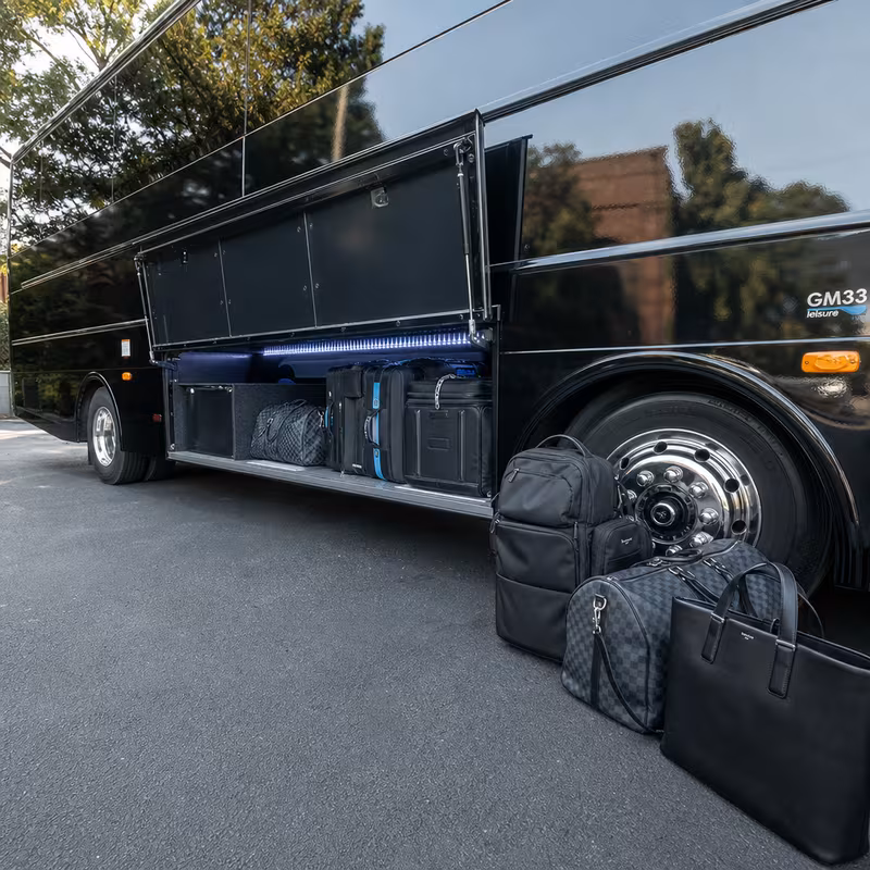 Party bus interior with wraparound leather seating and LED lighting in Omaha