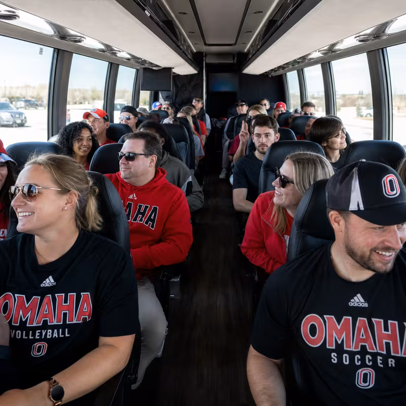 Black Mercedes Sprinter van staged for an Omaha Sporting Event Transportation group