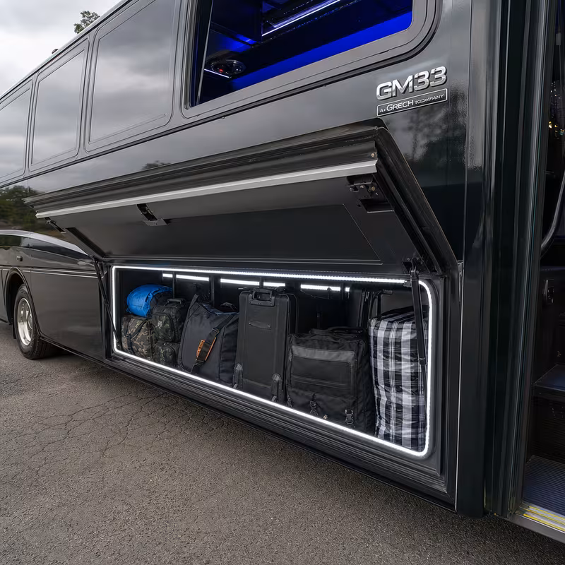 Party bus interior with wraparound leather seating and LED lighting in Omaha