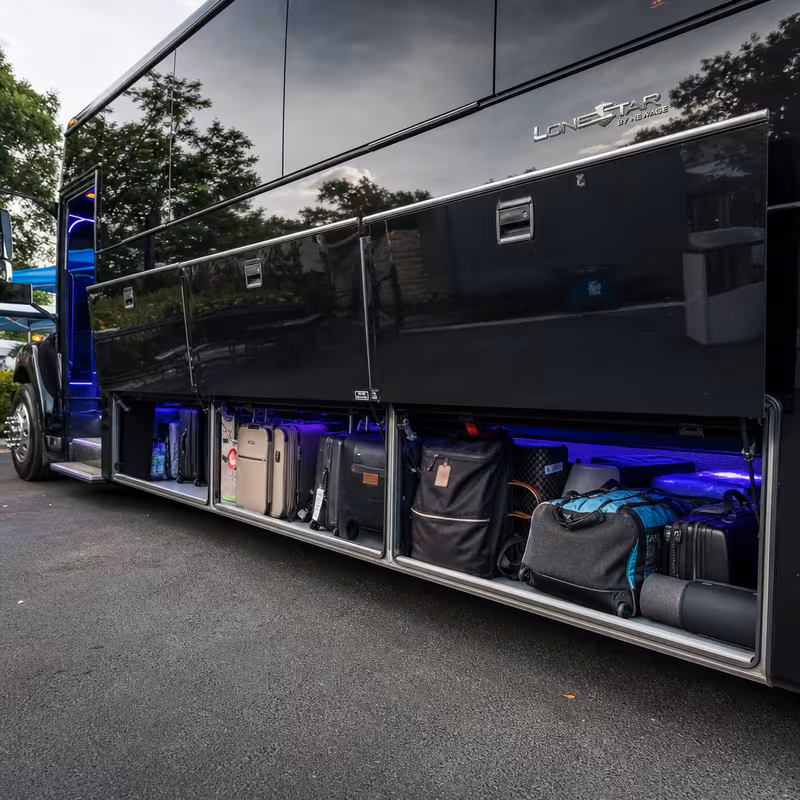Party bus interior with wraparound leather seating and LED lighting in Omaha
